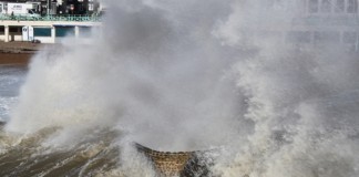 Heavy Fine For Yacht Club In Wales image of Waves breaking over groin in rough weather