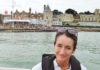 Southampton Boat Show 2016 – Ladies Day – Thursday 22nd September image of Magenta Edwards the-news.co's culture and arts editor against a backdrop of the starting line at the RYS Cowes