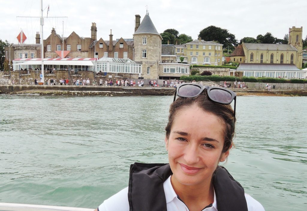 image of Magenta Edwards the-news.co's culture and arts editor against a backdrop of the starting line at the RYS Cowes