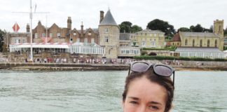 Southampton Boat Show 2016 – Ladies Day – Thursday 22nd September image of Magenta Edwards the-news.co's culture and arts editor against a backdrop of the starting line at the RYS Cowes