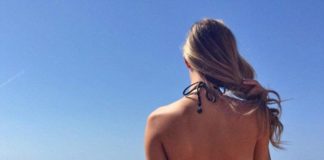 Brighton Beach Guards Now On Duty To Protect Swimmers image of girl viewing Calm seas at the beach