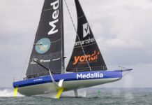 Fastnet 2023 – British Ocean Sailor Pip Hare names co-skipper Medallia-Pip Hare's refitted IMOCA Open60 race yacht. Credit Lloyd images